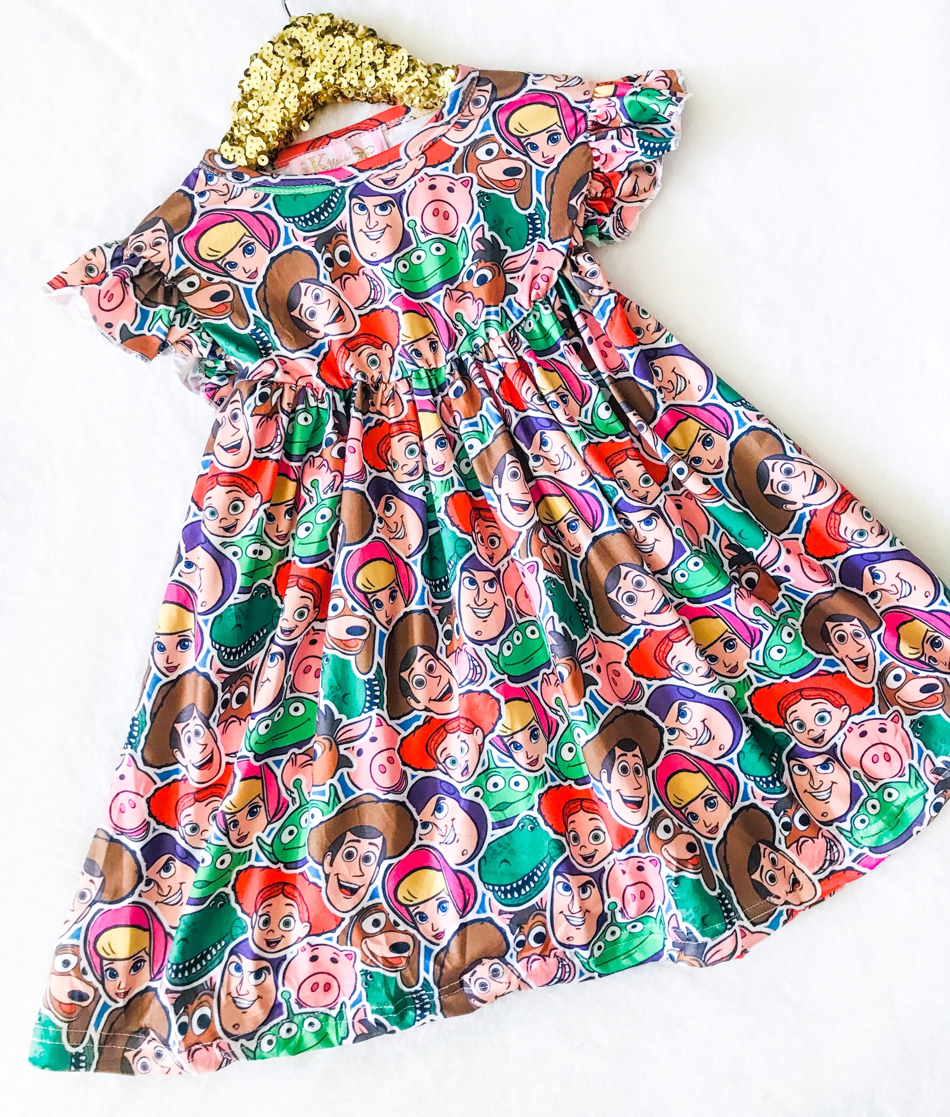 Girls Fun Character Dresses - Andy's Friends Heads | Red & Green - toy story characters, bo peep, aliens, porky, dino, woody, buzz lightyear, jessie, slinky dog