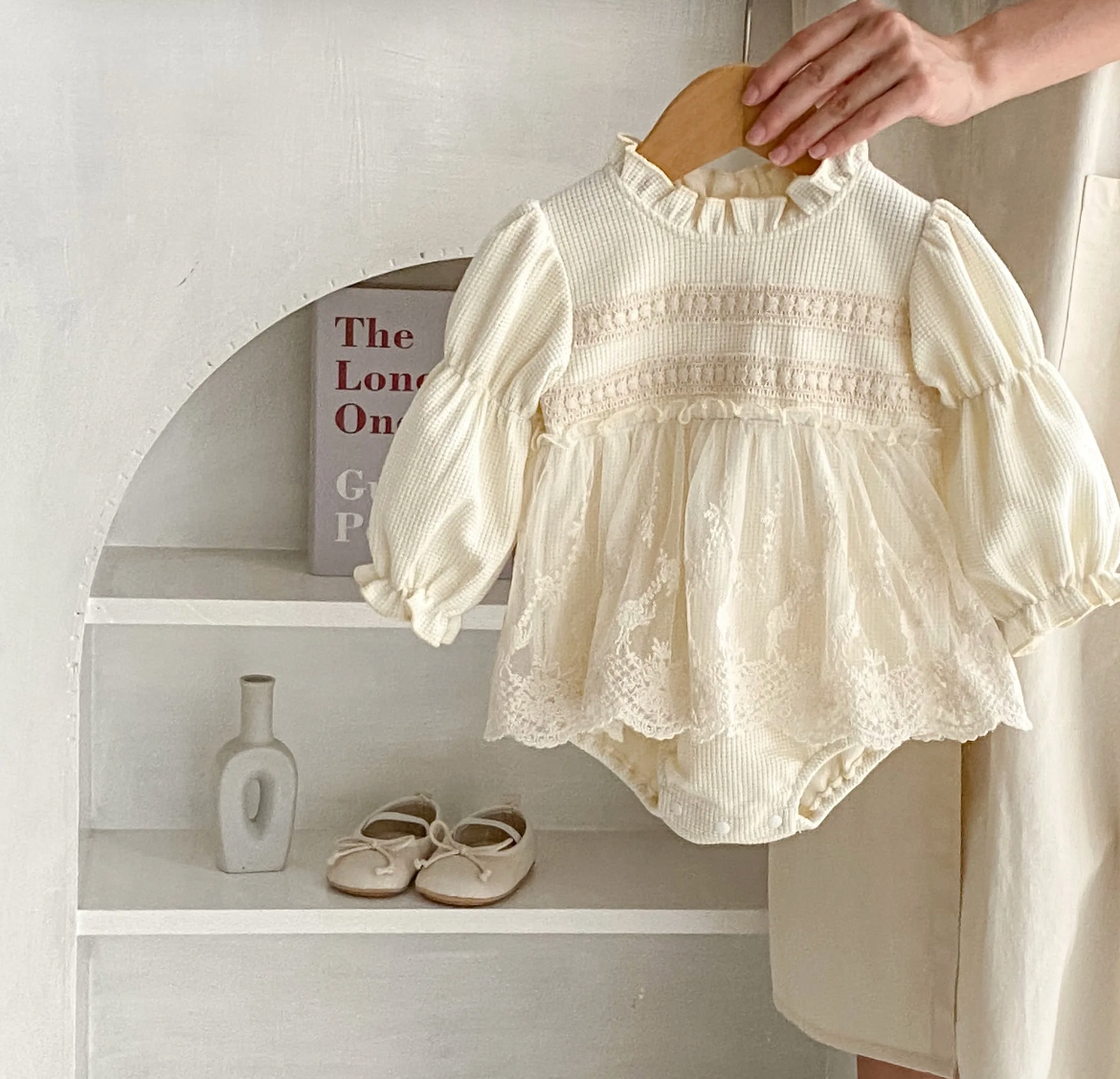 Baby Girls Ivory High Neck with Lace Skirted Romper - knit looking with sinching arms & wrists so the long sleeves can be up or down comfortably.