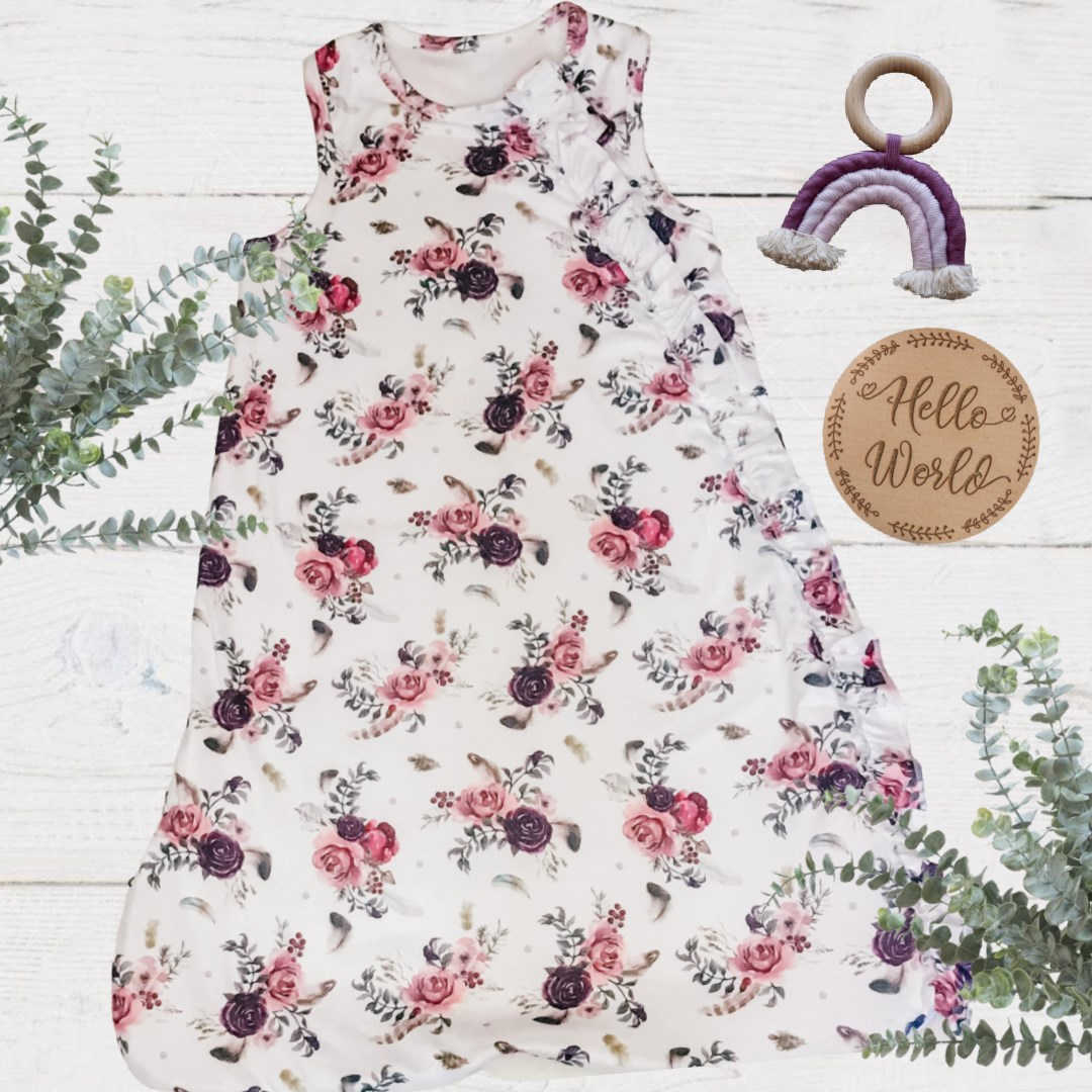 full length baby girls sleeveless sleep bag with white mulberry floral feather pattern and ruffle detail on the zipper area top to bottom.