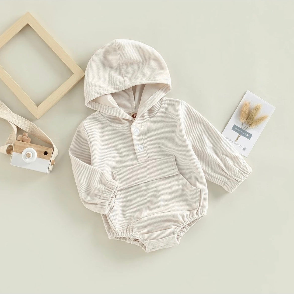 White rib romper with Hood, pocket, and white buttons at neckline