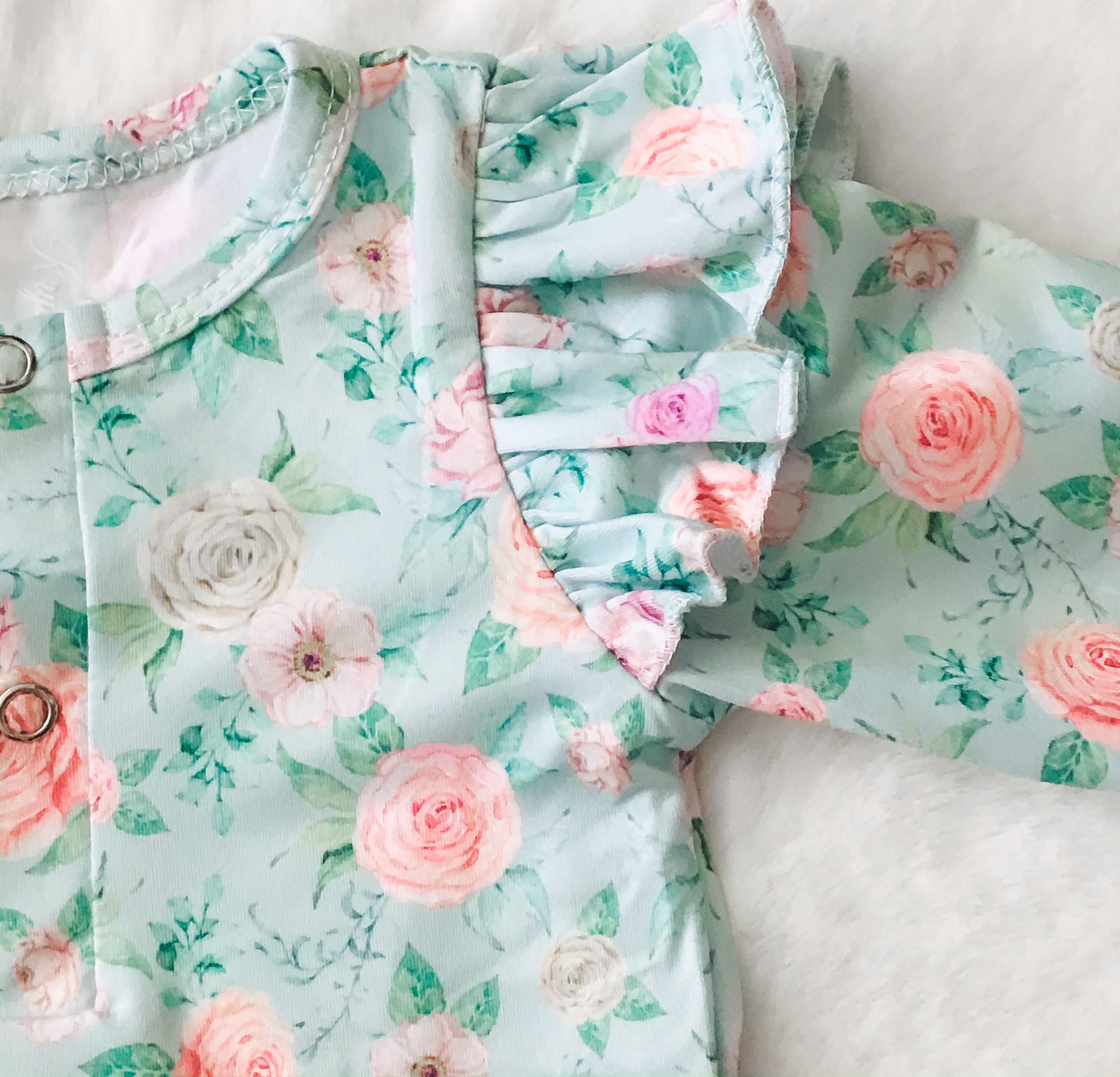 Baby Girls Mint Floral Deluxe Romper - close up of peony flowers and ruffle shoulder