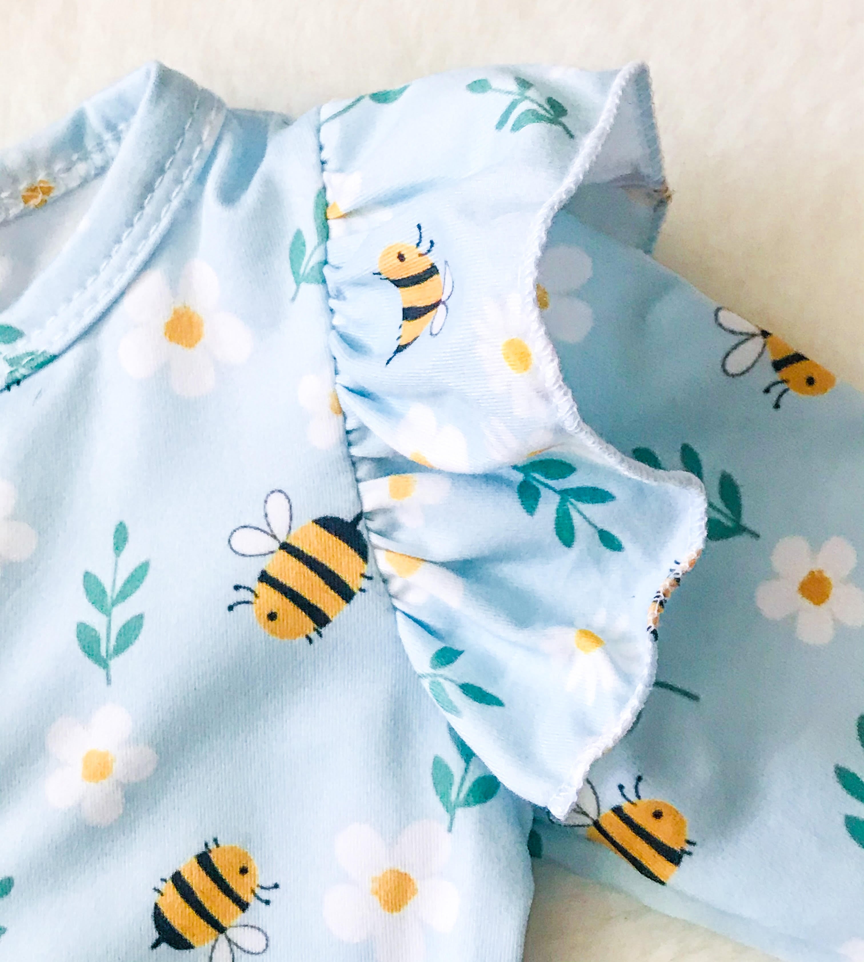 Baby Girls Blue Bees Deluxe Romper - close up of ruffle sleeves