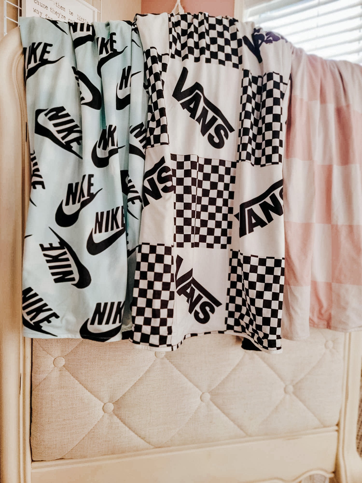 all 3 of our blankets - from left to right - Blue Nike, White Vans, Blush/Tan Check