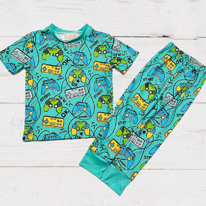 Boys 2-Piece Short Sleeve Pajamas - Turquoise Video Game controllers and phrases like "start" & "try again"