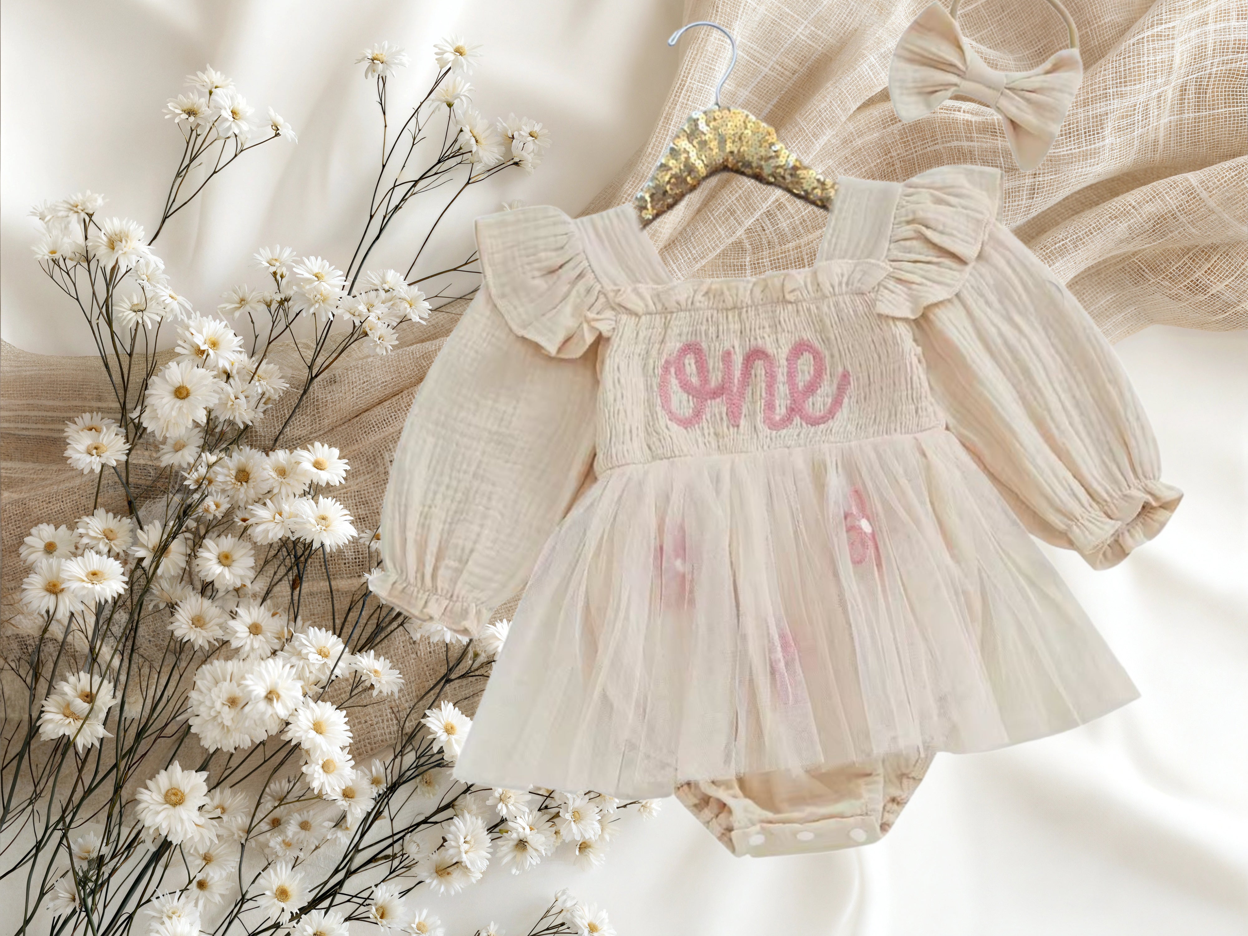COMING SOON - Baby Cream Long Sleeve Smocked “One” Birthday Romper Dress
