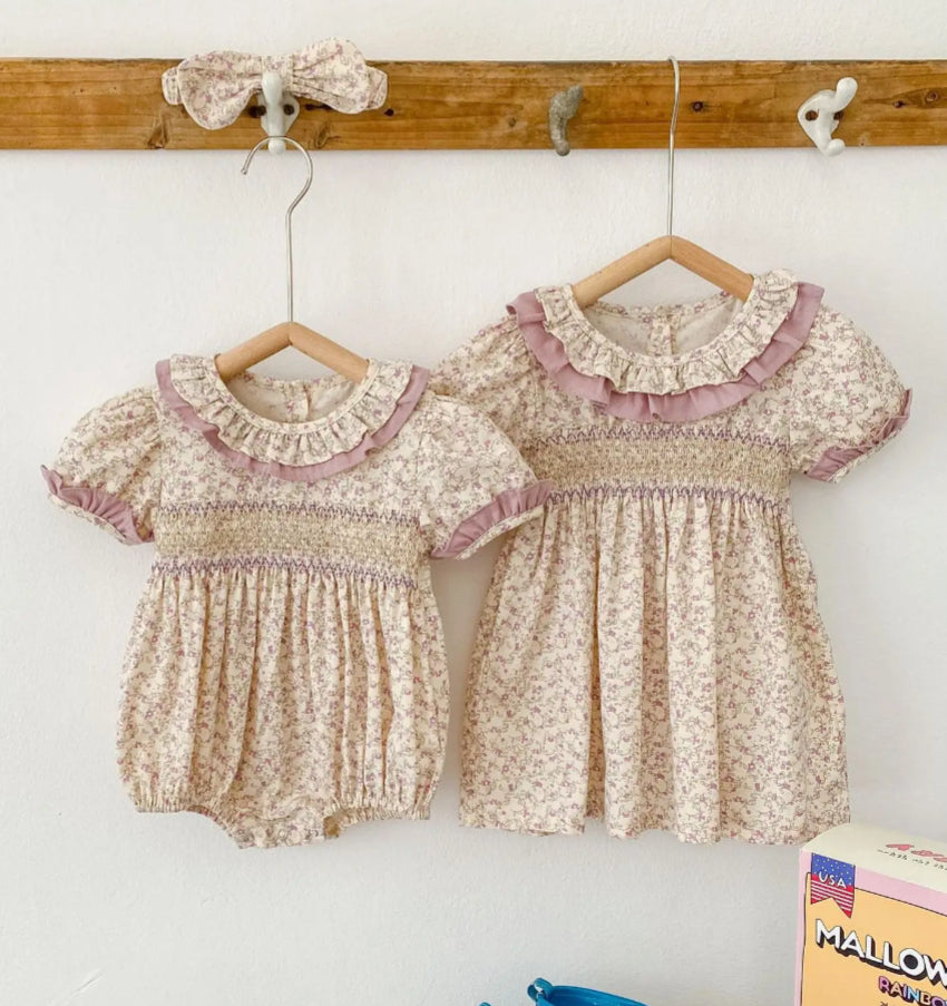 Baby & Toddler Girls Twinning - Mauve Vintage Floral Rompers & Dresses - romper to left, dress on right, cap sleeves on both outfits, accordian sinching at waist for both outfits