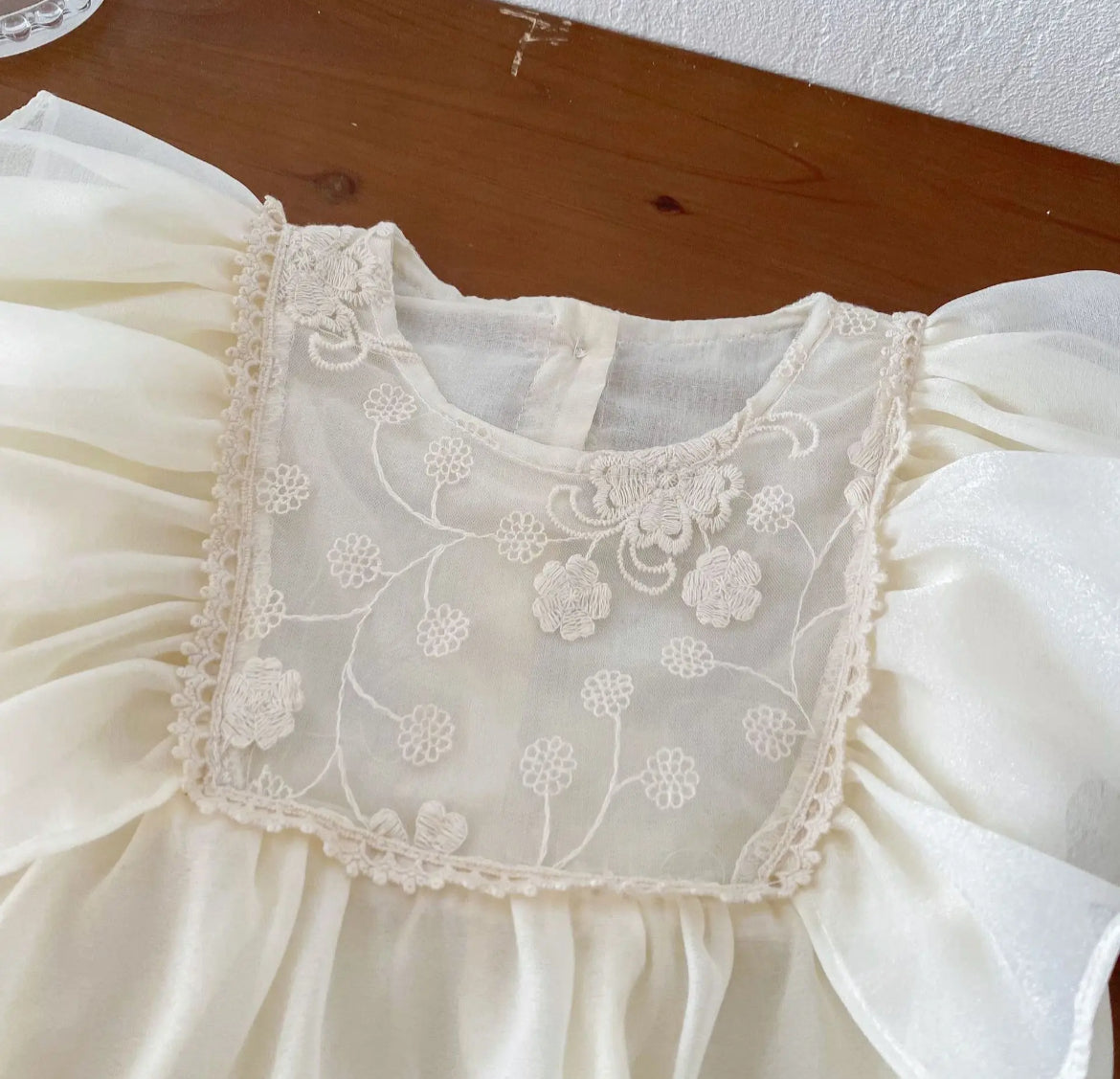 Baby Girls Romper - Ivory Ruffle with Lace Embroidered Bodice - showing the lace embroidered detailing