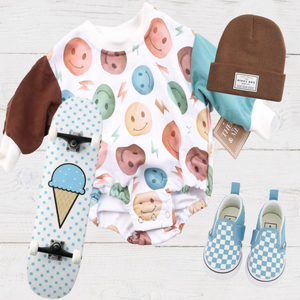 Products Theo & Me - Multi-Color Smiley Faces & Lightning Bolts Sweatshirt Romper - has color block sleeves - right arm is Brown - Left arm is Teal
