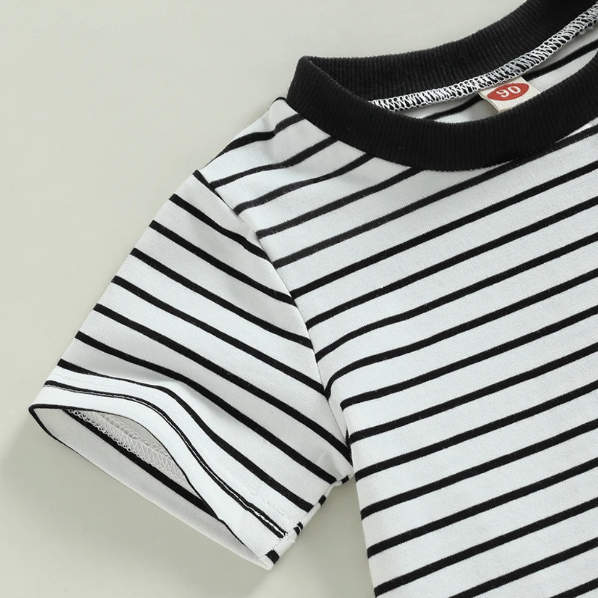 White with Black Stripe & Rust Pocket - close up on the sleeve