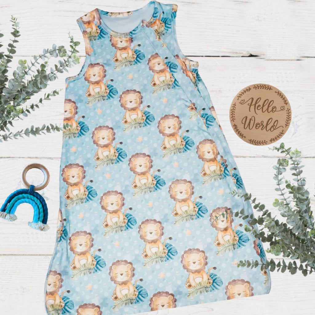 baby sleeveless sleep bag with blue background and cute cartoon lions all over
