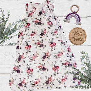 full length baby girls sleeveless sleep bag with white mulberry floral feather pattern and ruffle detail on the zipper area top to bottom.