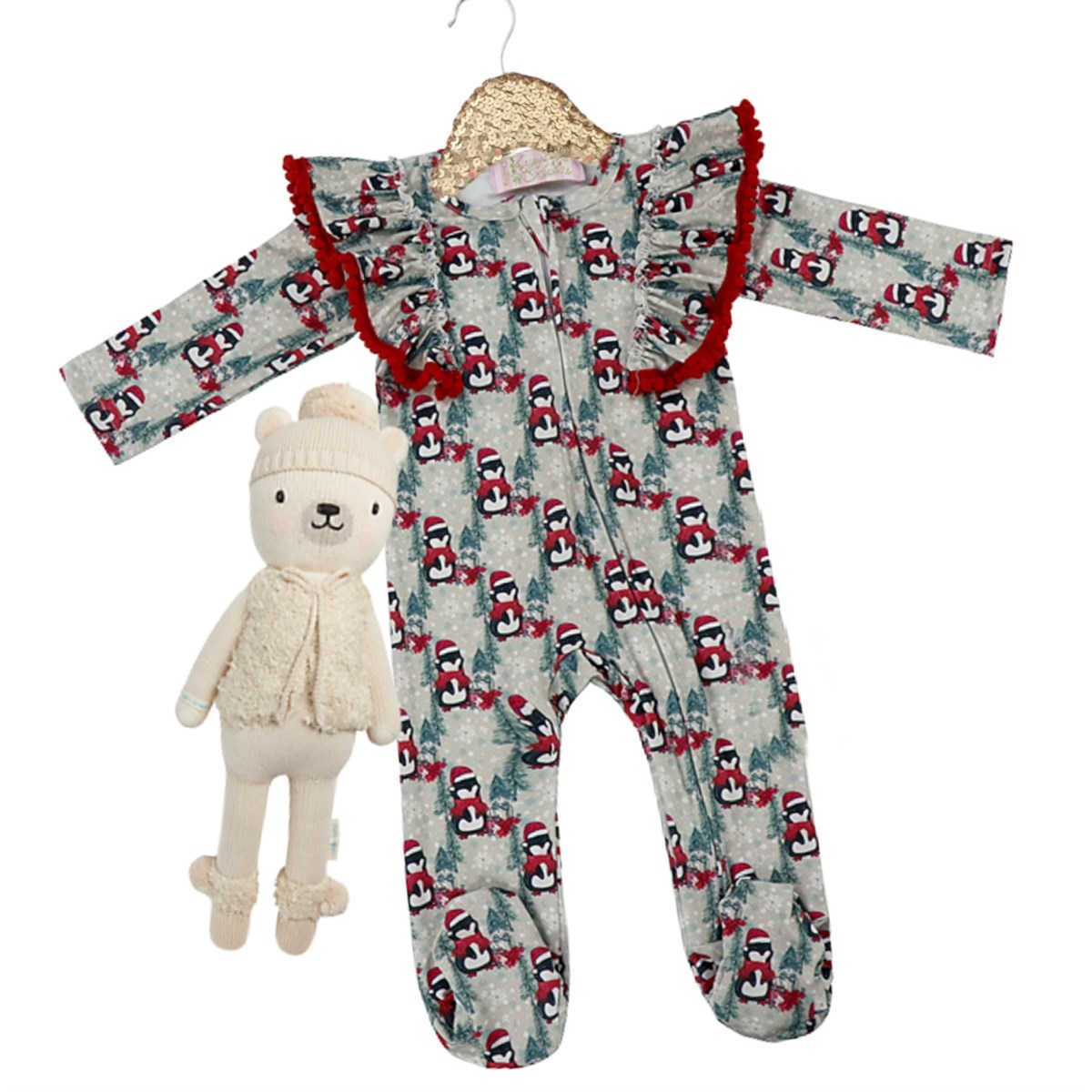Kryssi Kouture Sienna Holiday Infant Deluxe Tutu Jumpsuit - Grey Penguin Pom. With the pattern plus red poms on the shoulder ruffles.