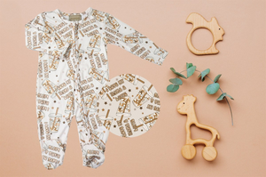 Boys Soft Sleepers With Double Zippers - I Love My Mama A Latte. Has tiny stars and iced coffee containers in a tan colour.