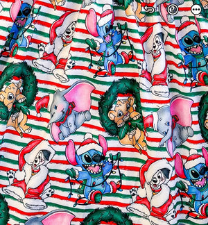 up close of Girls Fun Vacation Character Dresses - Lion & Friends Wreath Stripes. Showing a dalmation, dumbo, stitch & baby lion on top of red & green stripes.