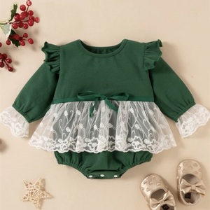 Baby Girl Vintage Lace Green Lace Skirted Romper. Has green ruffle detail on the shoulder, white lace ruffle detailing on wrists, and white lace ruffle skirt.