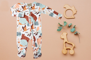 Boys Soft Sleepers With Double Zippers - Abstract Wildlife. Has bears, deer, canada geese, moose, and other animals in lighter neutral pastel colors