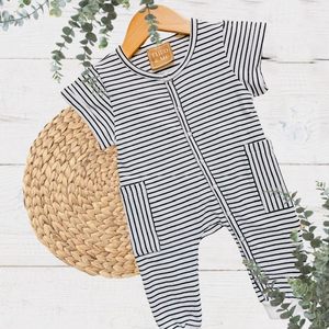 Theo & Me Black & White Stripe Snaps - Side Pocket Romper. Snaps run neck to foot. Pockets are at the hip.