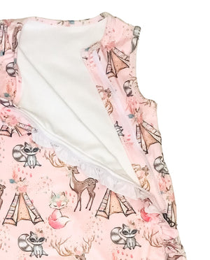 up close details on the baby sleeveless sleep bag with pink forest friends print. Shows zipper located on the right side of the photo. It is unzipped and has ruffles. zipper will be on left side of baby when worn.