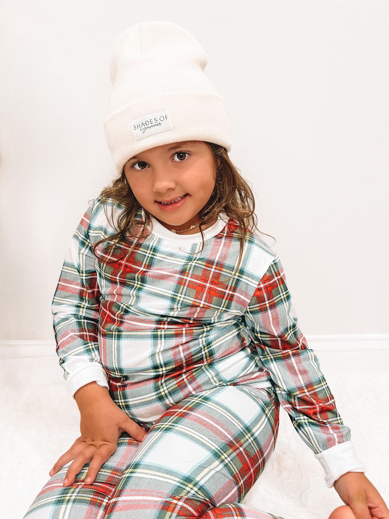 older child wearing the 2 Pc Christmas Pajamas - Stuart Tartan Holiday Plaid