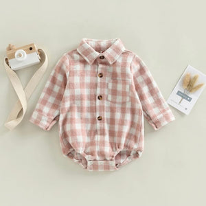pink check flannel romper with a collar, buttons down the chest, and a pocket over the heart area.