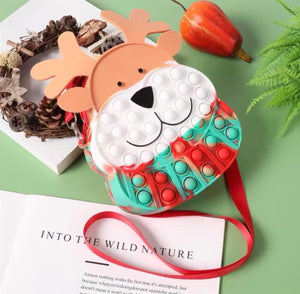 kids reindeer pop-it purse with red strap flatlay