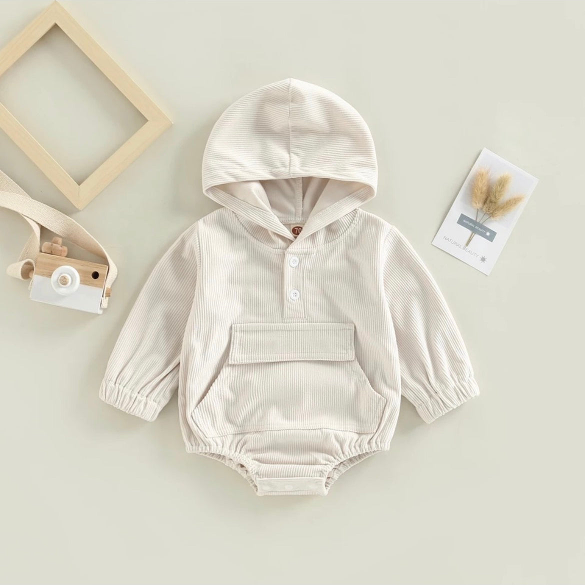 White rib romper with Hood, pocket, and white buttons at neckline